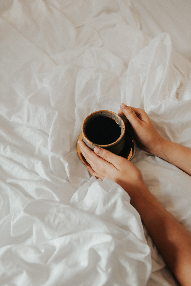 Cup of Coffee on Bed